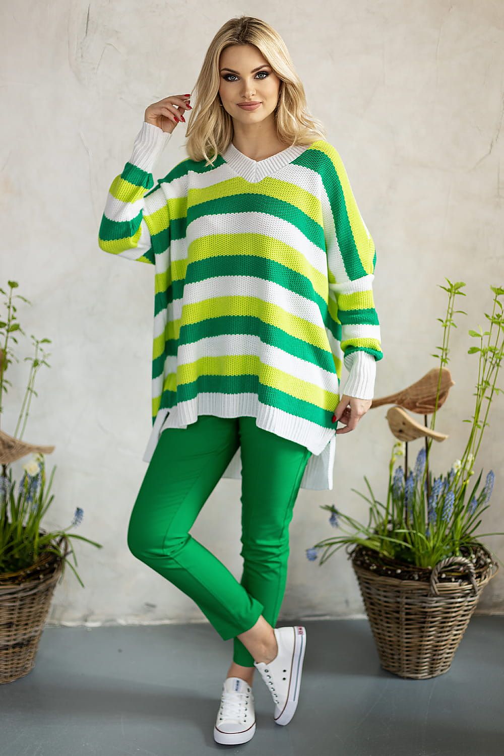 Stunning oversized sweater with eye-catching stripes in green and yellow, perfect for elegant styling, by PeeKaBoo.