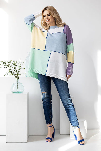 PeeKaBoo Colour Block Loose-Fitting Sweater in pastel hues. Model poses confidently with long sleeves and stylish jeans against a bright background, highlighting the elegance of this acrylic and cotton blend.