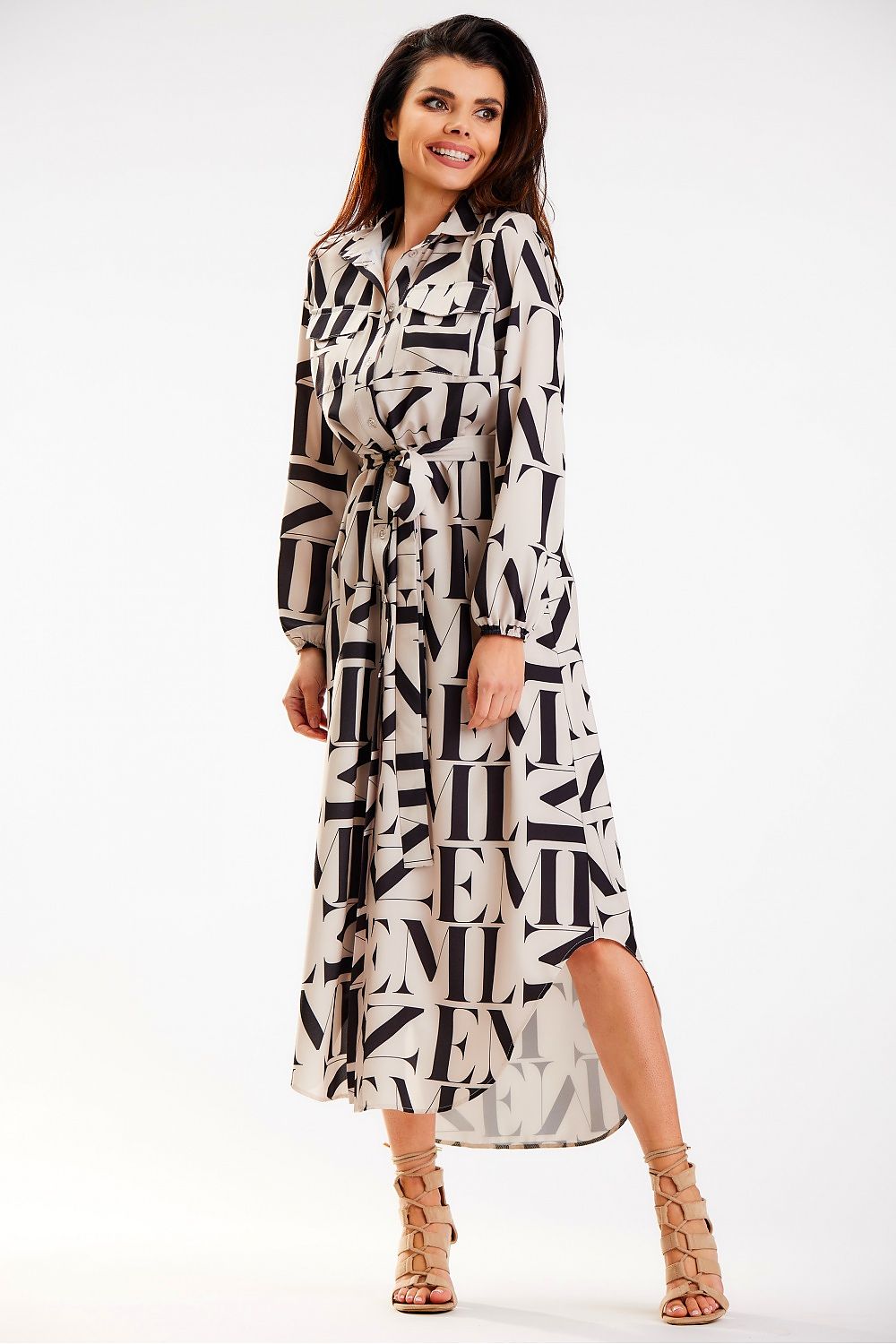 Sleek Awama maxi dress with elegant long sleeves and a chic belt, showcasing a fashionable design and flattering silhouette, crafted in Poland.
