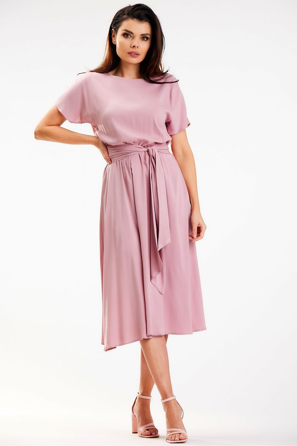 Chic midi length kimono dress by Awama in soft pink viscose, elegantly tied at the waist with a sash, ideal for sophisticated occasions.