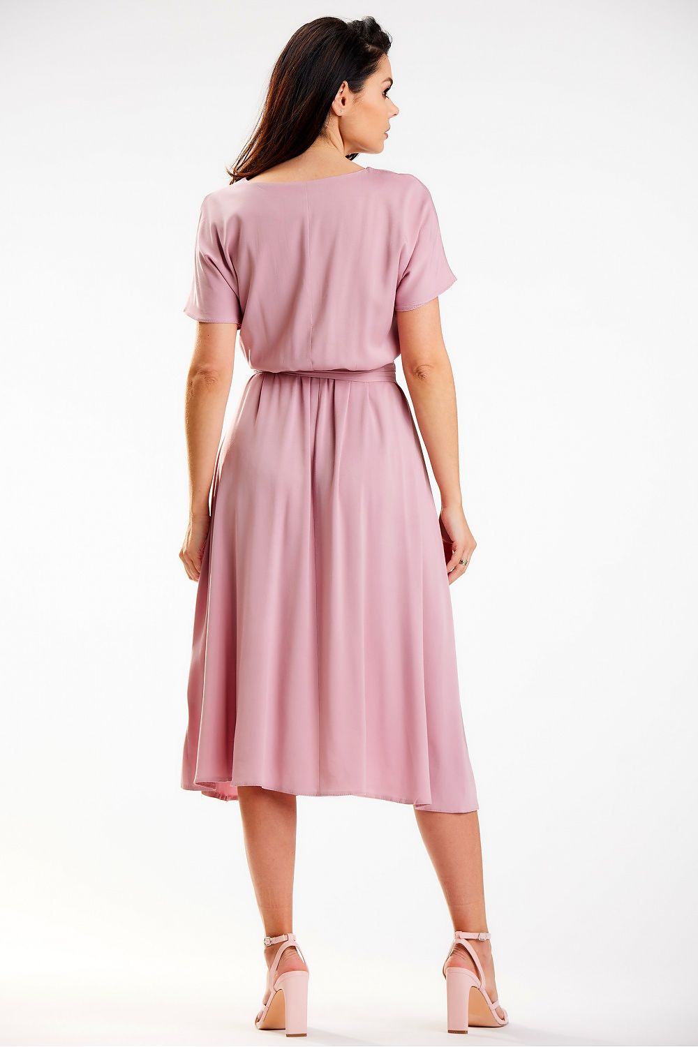 Back view of the soft pink kimono dress by Awama, highlighting the airy fabric and elegant waist sash, ideal for sophisticated occasions.