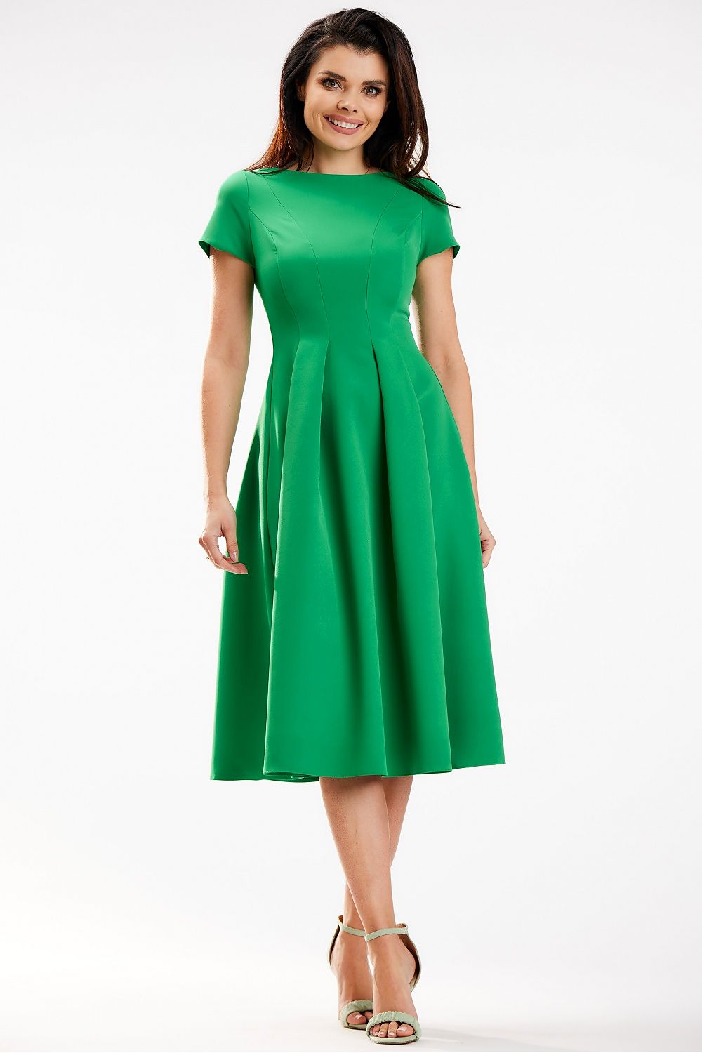 Elegant green midi dress by Awama featuring a boat neckline and short sleeves, showcasing a flattering silhouette perfect for any occasion.