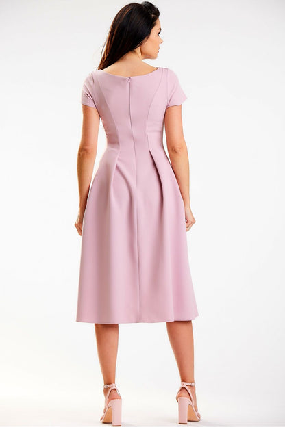 Back view of a refined pink midi dress with a boat neckline by Awama, highlighting its elegant pleating and flawless fit for a contemporary look.