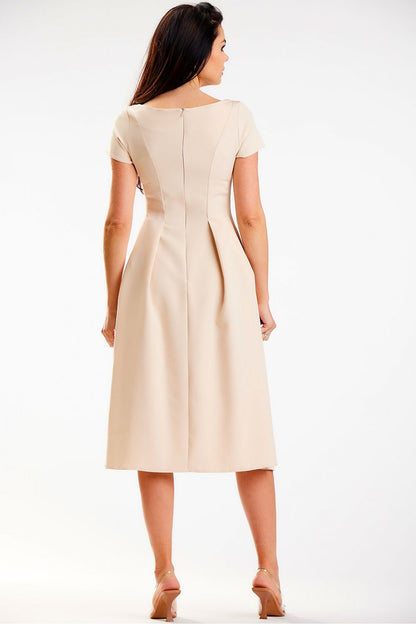 Back view of an elegant midi dress by awama, showcasing its structured design and concealed zipper detail, highlighting luxury and sophistication.