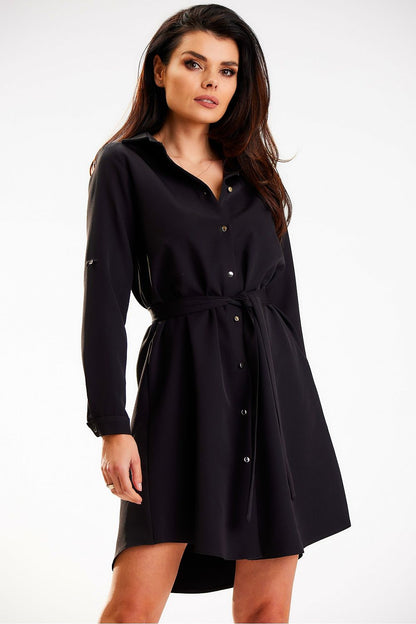 Sophisticated Awama shirt mini dress in elegant black, designed with long sleeves and a stylish belt, luxurious gold button accents for a refined look.