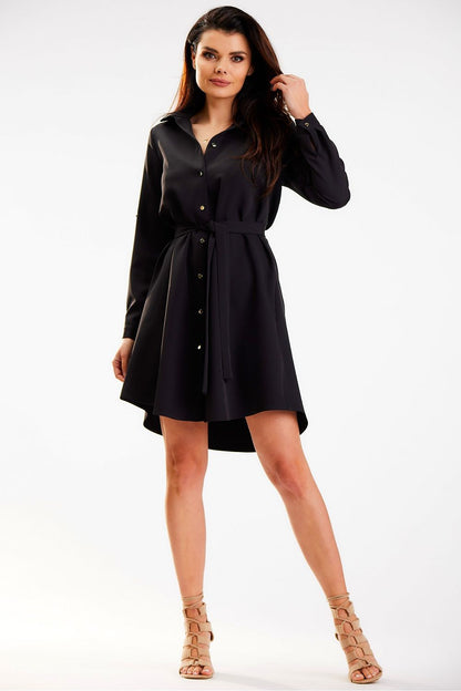 Chic Awama black shirt mini dress featuring a flattering silhouette, gold button details, and a cinched waist belt, epitomizing modern elegance.