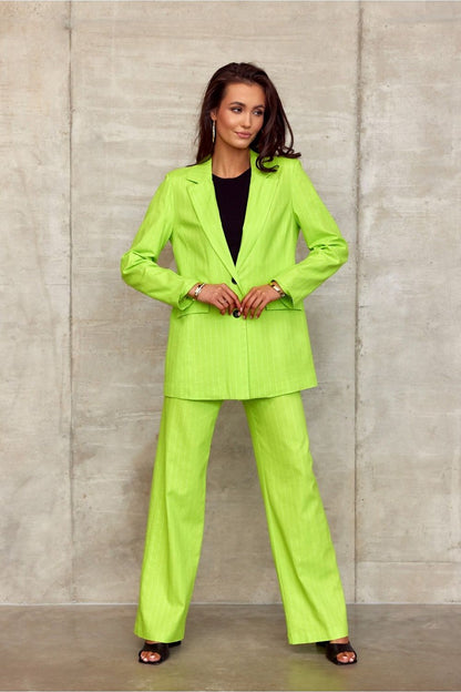 Model confidently displaying Roco Fashion's stylish lime green blazer and wide cut trousers ensemble, ideal for a contemporary and refined wardrobe.