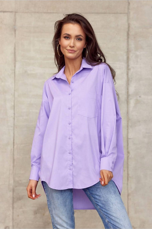 Elegantly dressed model showcasing Roco Fashion Women's oversized long sleeve shirt in pastel purple, featuring an asymmetrical hem and sophisticated collar against a minimalist background.
