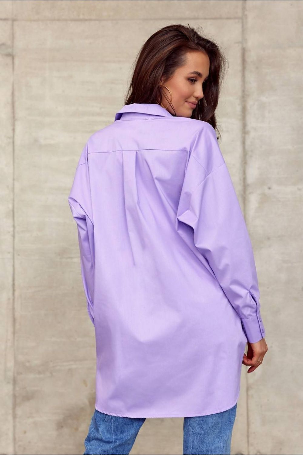 Back view of a model in Roco Fashion Women's oversized long sleeve shirt, highlighting the elegant collar and unique design details in a sophisticated pastel purple.