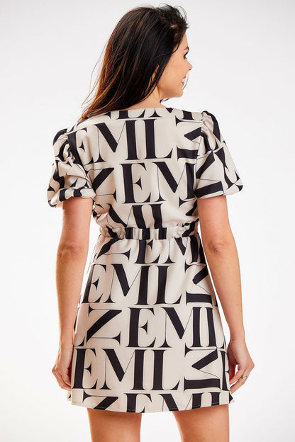 Sophisticated back view of an Awama beige crepe mini dress with stylish puff sleeves, showcasing an elastic waistband that enhances the feminine form.