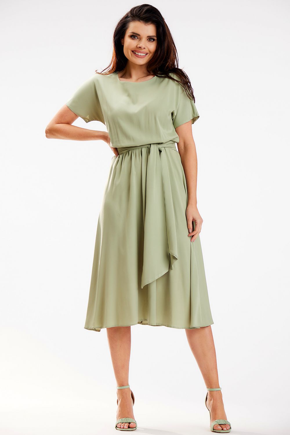 Elegant midi length kimono dress by Awama in soft green viscose, featuring a sash detail, perfect for both work and leisure, model showcasing the front view.