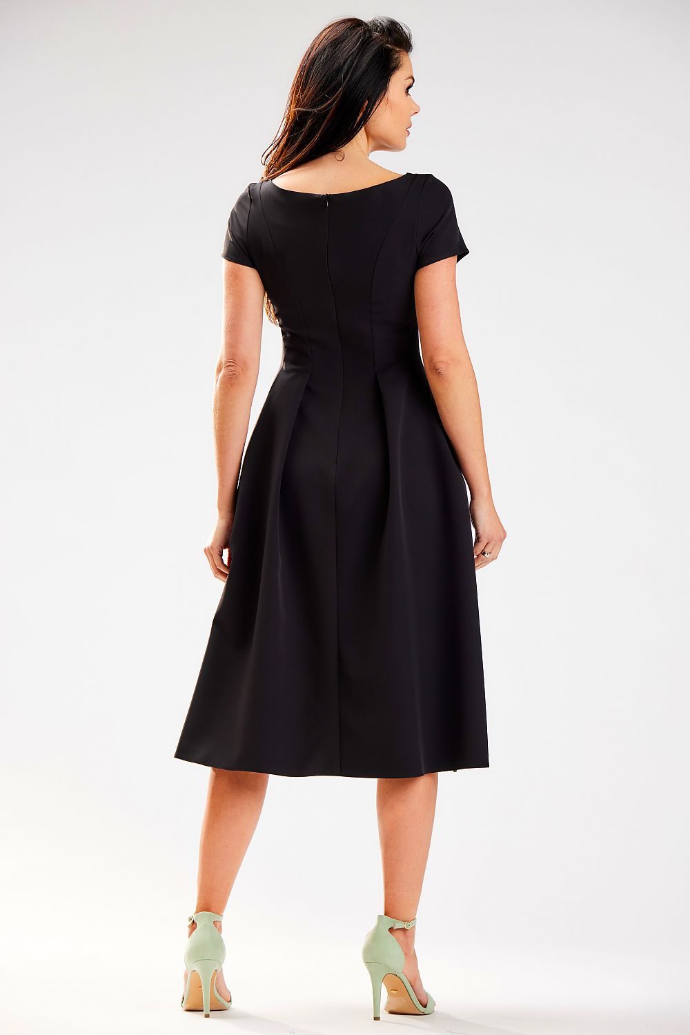 Rear view of a sophisticated black midi dress by Awama, featuring a pleated design and elegant short sleeves.