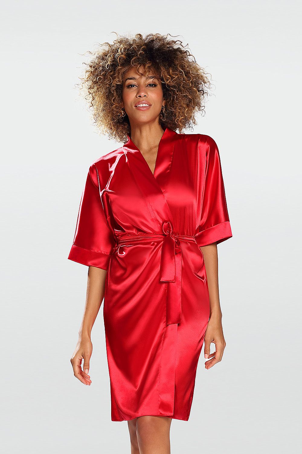 DCare Short-Sleeved Satin Bathrobe in Red, showcasing an elegant fit and waist tie, modelled by a woman with curly hair, exuding luxury and comfort.