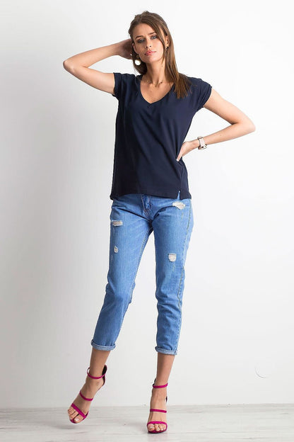 Fashionable women's navy V-neck t-shirt by BFG, paired with distressed denim for a modern yet elegant outfit.