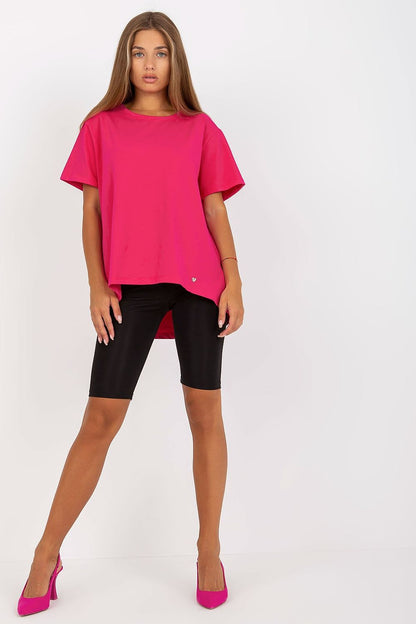 Luxury Women's BFG T-Shirt in vibrant pink, featuring a round neckline and short sleeves, styled with black cycling shorts and pink heels. Ideal for fashionable casual wear.