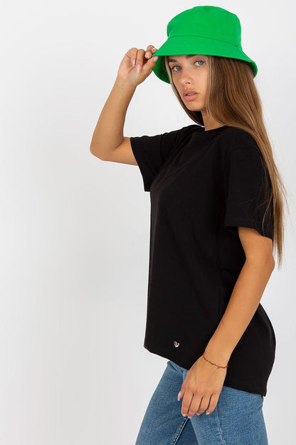 Side profile of model in Luxury Women's BFG T-Shirt in black, highlighting its relaxed fit and stylish pairing with a green bucket hat.