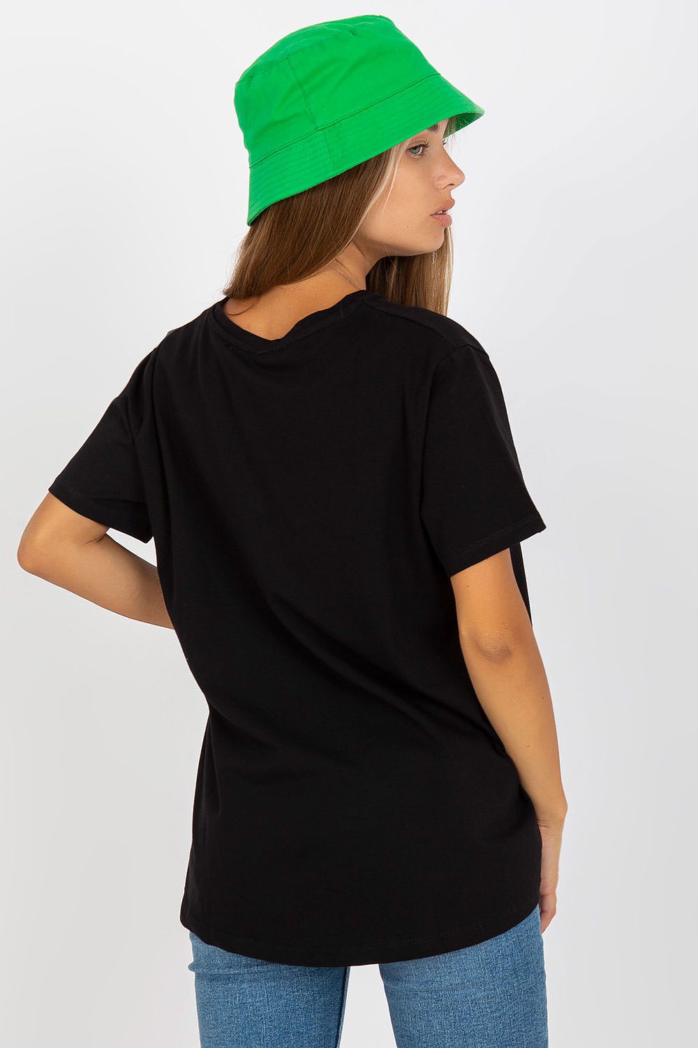 Back view of model in black Luxury Women's BFG T-Shirt topped with a green bucket hat, exuding a modern and fashionable vibe.
