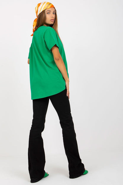 Back view of the Luxury Women's BFG T-Shirt in bold green, demonstrating a contemporary silhouette while accessorised with a complementary headscarf.
