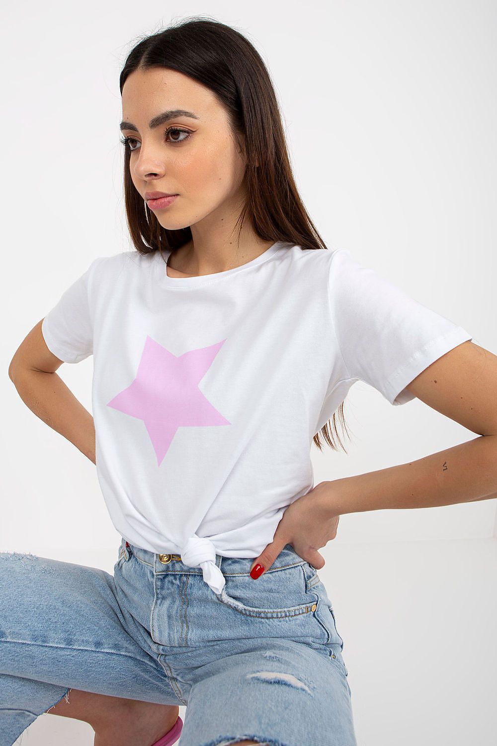 Close-up of a luxury women's cotton spandex BFG T-shirt in white with a subtle pink star print, effortlessly knotted for a fashionable swing.