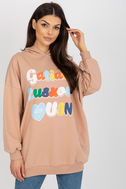 Luxurious women's hooded sweatshirt in soft beige with long sleeves featuring vibrant decorative inscription, styled by Fancy.