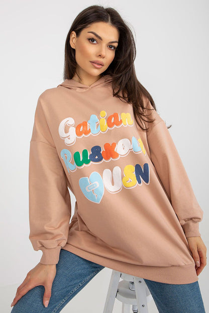 Elegant women's oversized beige hooded sweatshirt with playful front inscription, showcasing a relaxed silhouette, designed by Fancy.