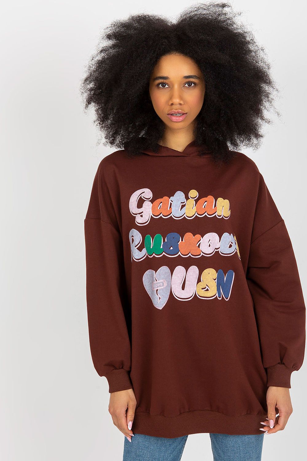 Stylish women's brown hooded sweatshirt with playful decorative text, presented by Fancy, merging comfort with high-end fashion.
