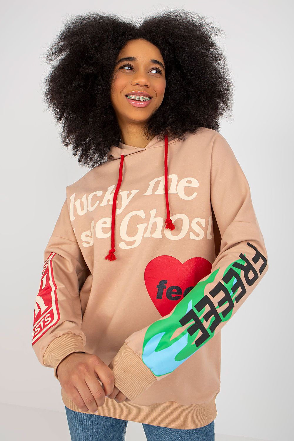 Chic women's hoodie sweatshirt from Fancy adorned with stylish lettering and vibrant colours, showcasing long sleeves and functional pockets.