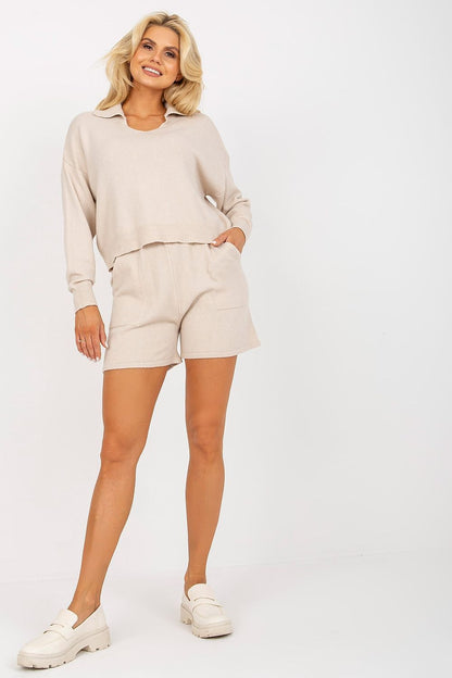 Luxury casual 2-piece set by EM featuring a looser cut long-sleeve sweater paired with stylish short shorts, ideal for a chic yet comfortable look.