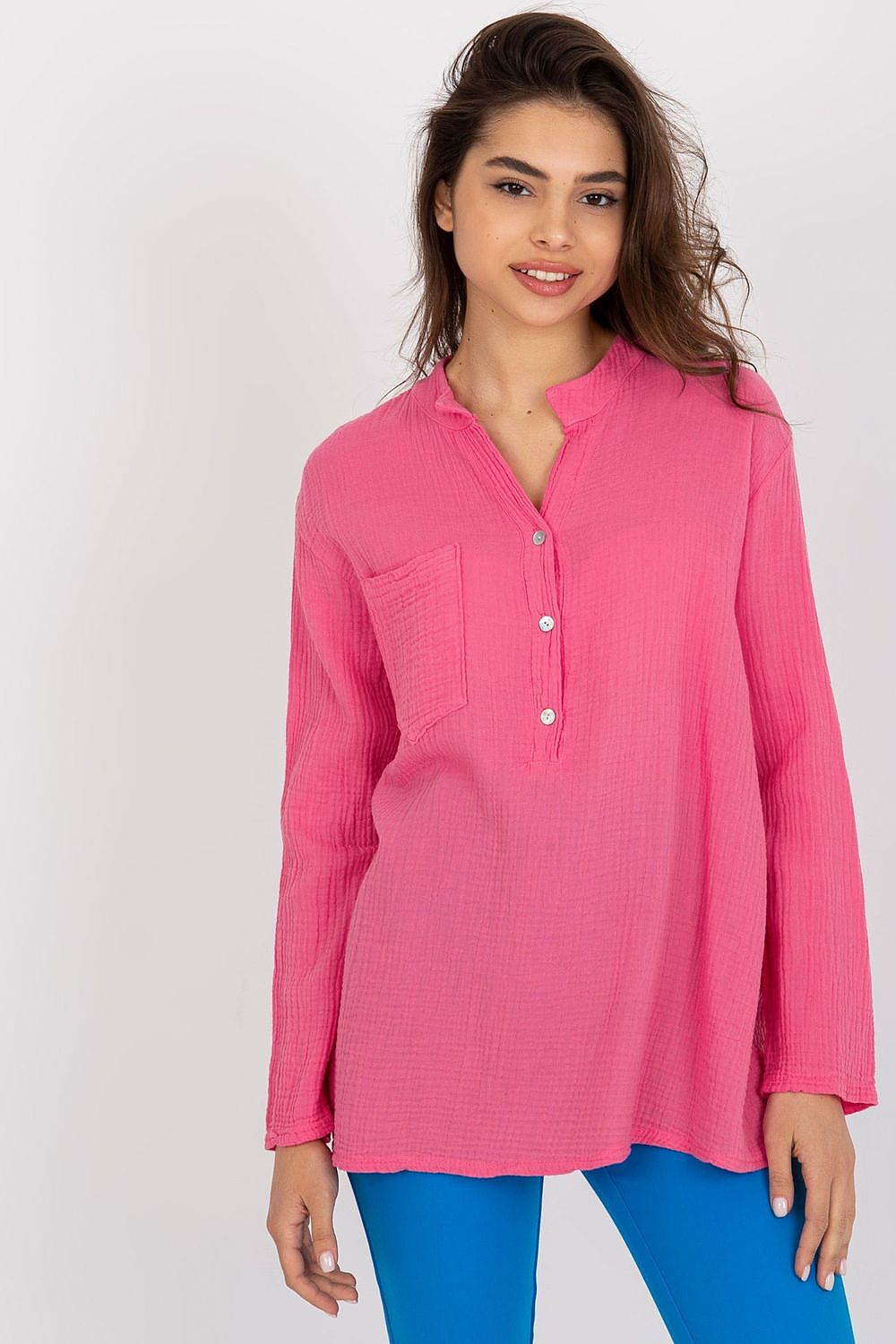 Elegant pink cotton muslin blouse by Och Bella, featuring a relaxed fit, long sleeves, a stylish v-neck, and a front pocket, perfect for sophisticated casual wear.