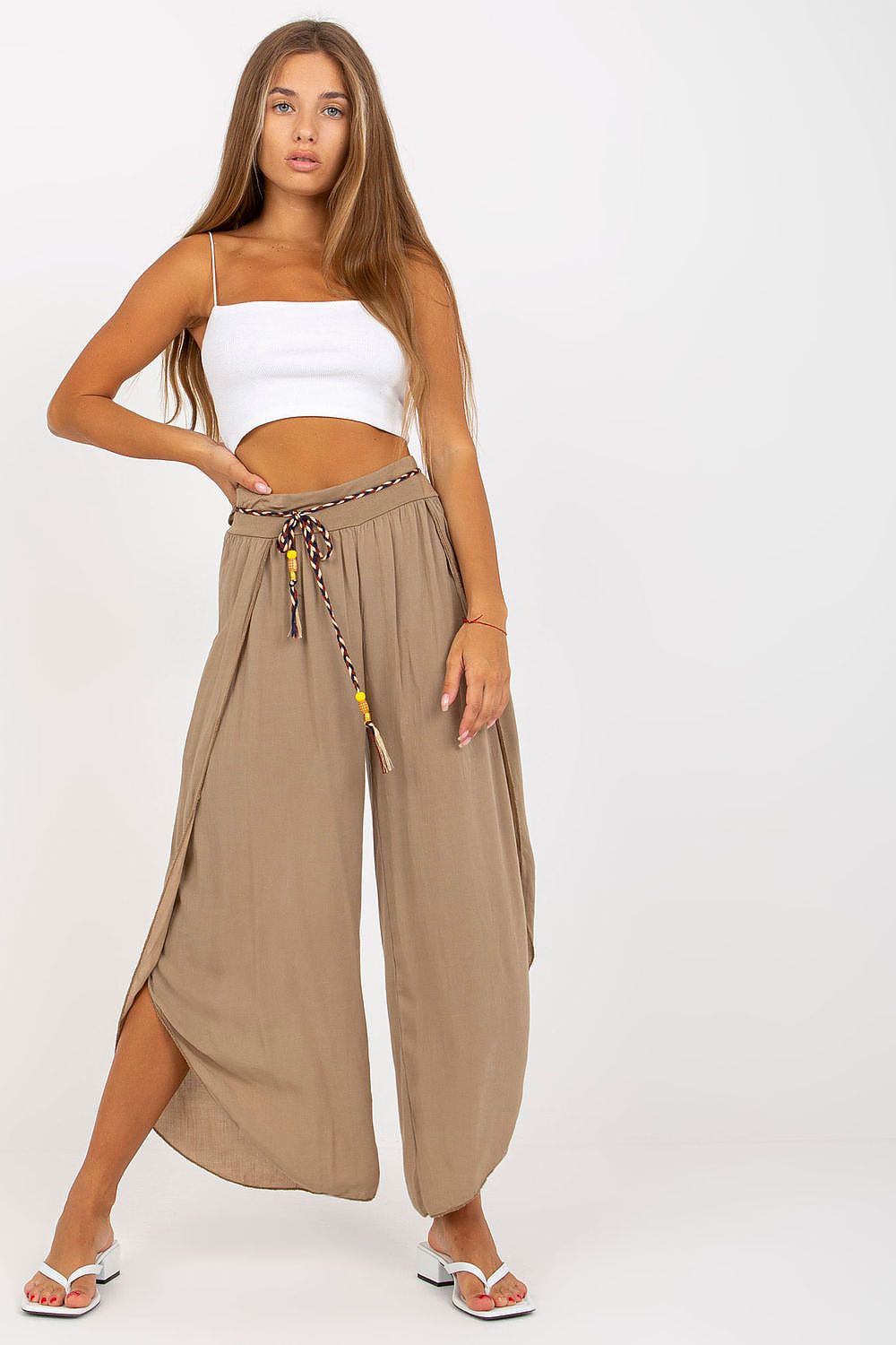 Front view of chic high-waist trousers from Och Bella in a soft taupe colour, featuring a decorative waistband, styled perfectly for a fashionable ensemble.