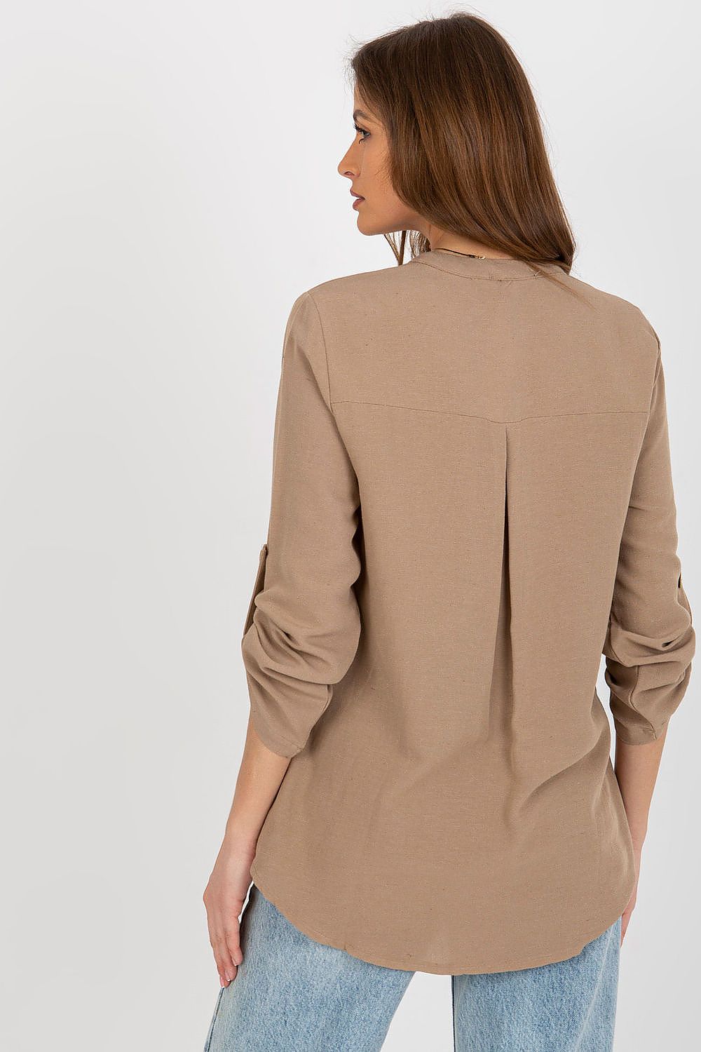 View of the back of the Rue Paris cotton blend blouse with long sleeves and a pleated detail, highlighting its fashionable yet elegant design, ideal for versatile wear.