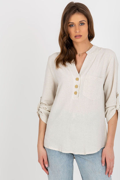 Luxurious Rue Paris cotton blend blouse featuring long sleeves and a heart-shaped neckline, styled elegantly with decorative buttons and a pocket.