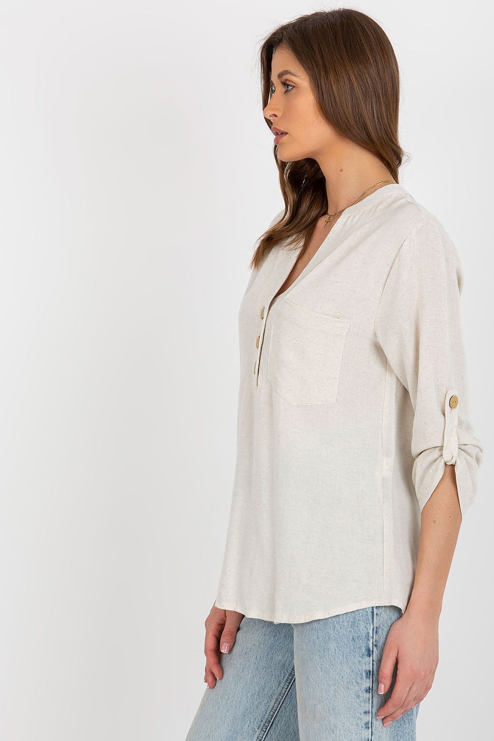 Sophisticated side view of the Rue Paris long-sleeved blouse in a refined cotton blend, highlighting the delicate heart-shaped neckline and stylish detailing.