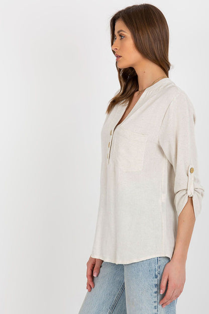 Sophisticated side view of the Rue Paris long-sleeved blouse in a refined cotton blend, highlighting the delicate heart-shaped neckline and stylish detailing.