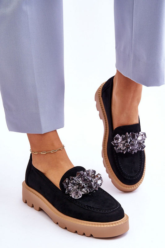 Elegant women's crystal-embellished eco-suede moccasins on a stylish platform, designed by Step in Style, showcased with tailored trousers.
