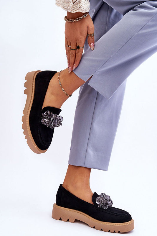 Chic black eco-suede moccasins with crystal details, featured by Step in Style, styled with sophisticated trousers and delicate accessories.