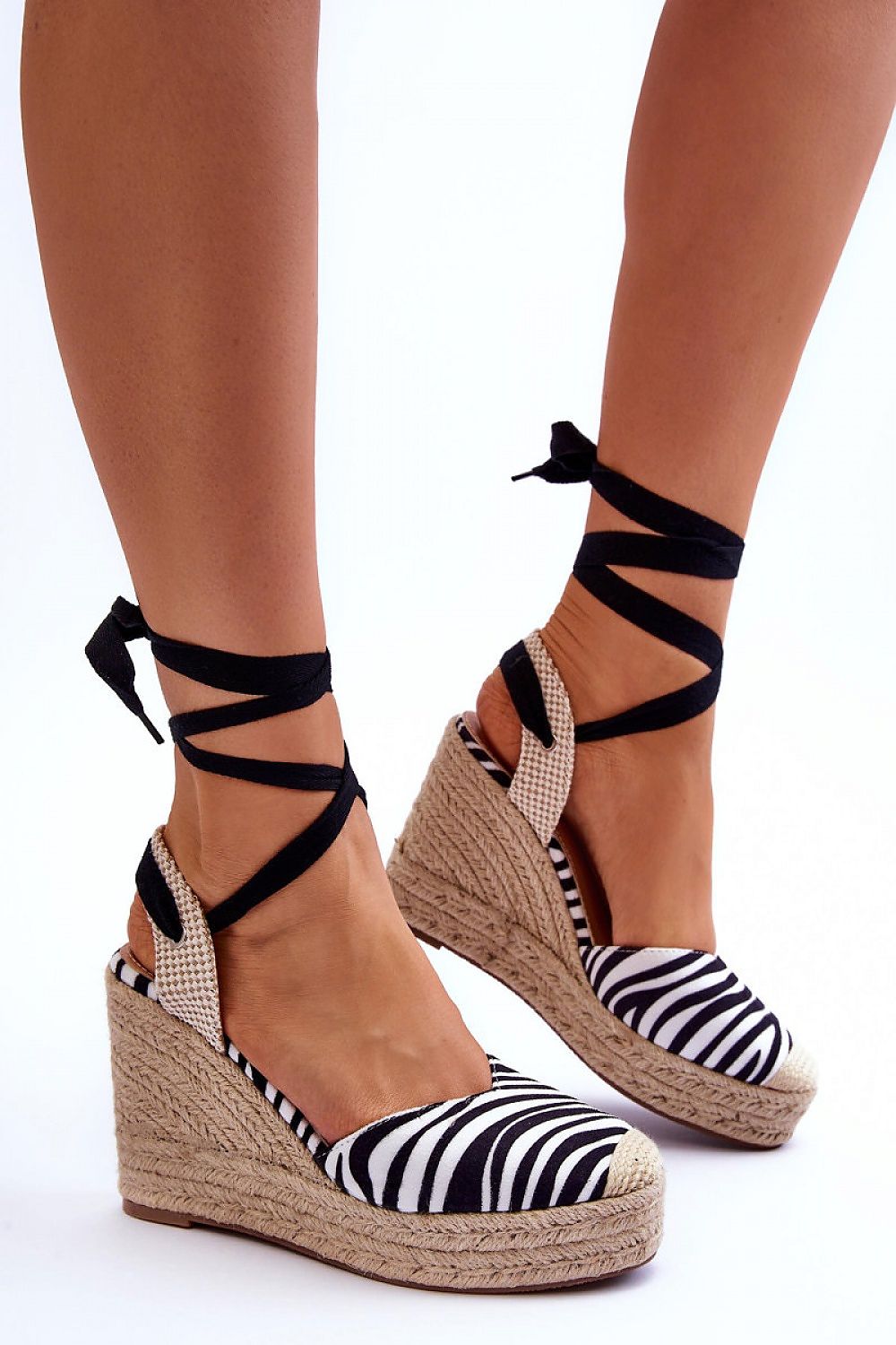 Sophisticated black and white striped eco-suede sandals by Step in Style, featuring a stylish jute braid and a comfortable non-slip sole, perfect for luxury summer engagements.