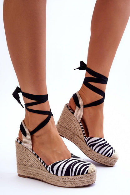 Sophisticated black and white striped eco-suede sandals by Step in Style, featuring a stylish jute braid and a comfortable non-slip sole, perfect for luxury summer engagements.