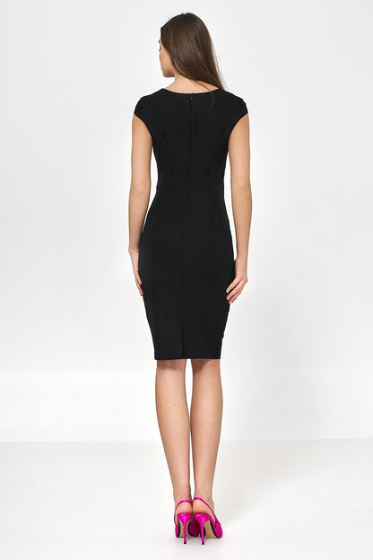 Back view of Nife pencil dress, revealing sleek design and fitted silhouette, accentuated by the model's elegant stance.