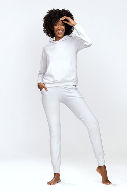 Dkaren luxury hoodie and classic sweatpants set in white, highlighting a cheerful woman showcasing a stylish homewear ensemble with a front pocket design.