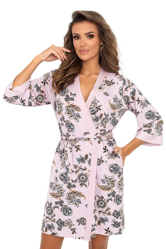 Elegant luxury pink viscose bathrobe by Donna featuring intricate floral oriental motifs, complete with a flattering wrap design and comfortable pockets. Perfect for a lavish lounging experience.