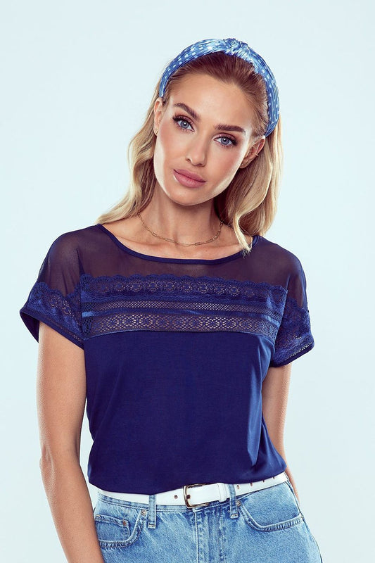 Eldar Luxury Batwing Blouse featuring lace insert details and short sleeves, worn by a stylish model with a chic headband.