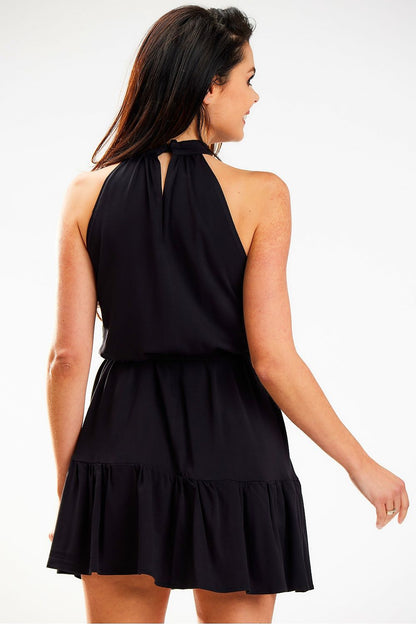 Stylish back view of a black loose flared daydress with a decorative neckline and waist tie, expertly designed by Awama. Perfectly encapsulating modern elegance and comfort.