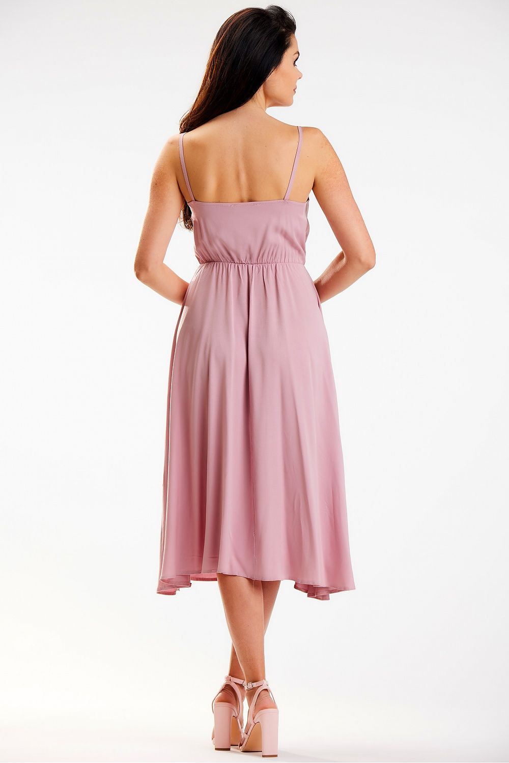 Elegant Awama midi dress in soft pink, featuring a crinkled neckline and elastic waistband, showcased from the back.