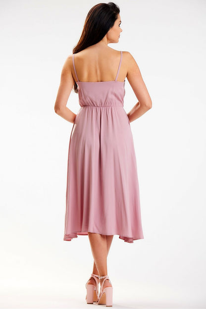 Elegant Awama midi dress in soft pink, featuring a crinkled neckline and elastic waistband, showcased from the back.