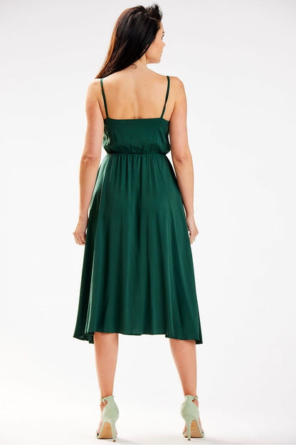 Sophisticated Awama midi dress in vibrant green, back view showcasing a flattering elastic waistband and delicate straps.