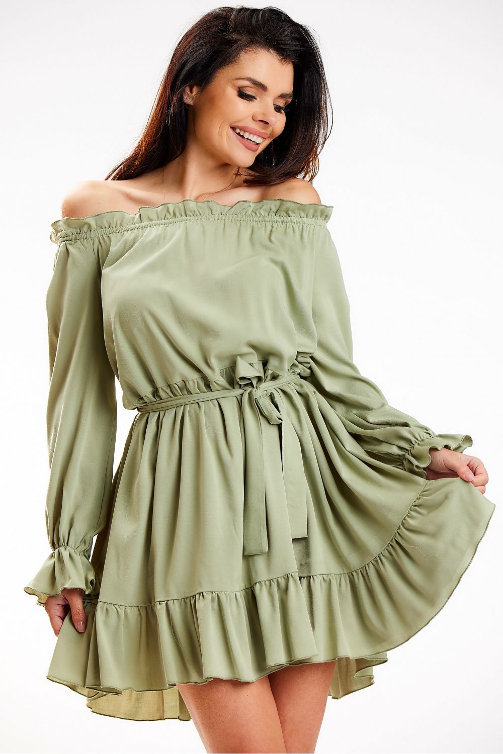 An elegant Awama Spanish A-Line dress in soft green, featuring long sleeves and a frill hem, styled with a waist belt, ideal for versatile fashion statements.