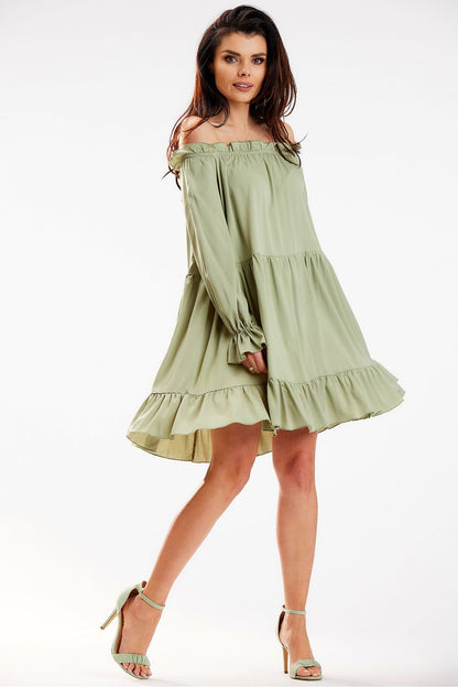 A chic Awama Spanish A-Line dress in soft green, showcased with an off-shoulder neckline, elegantly flared hem, perfect for both casual and festive occasions.
