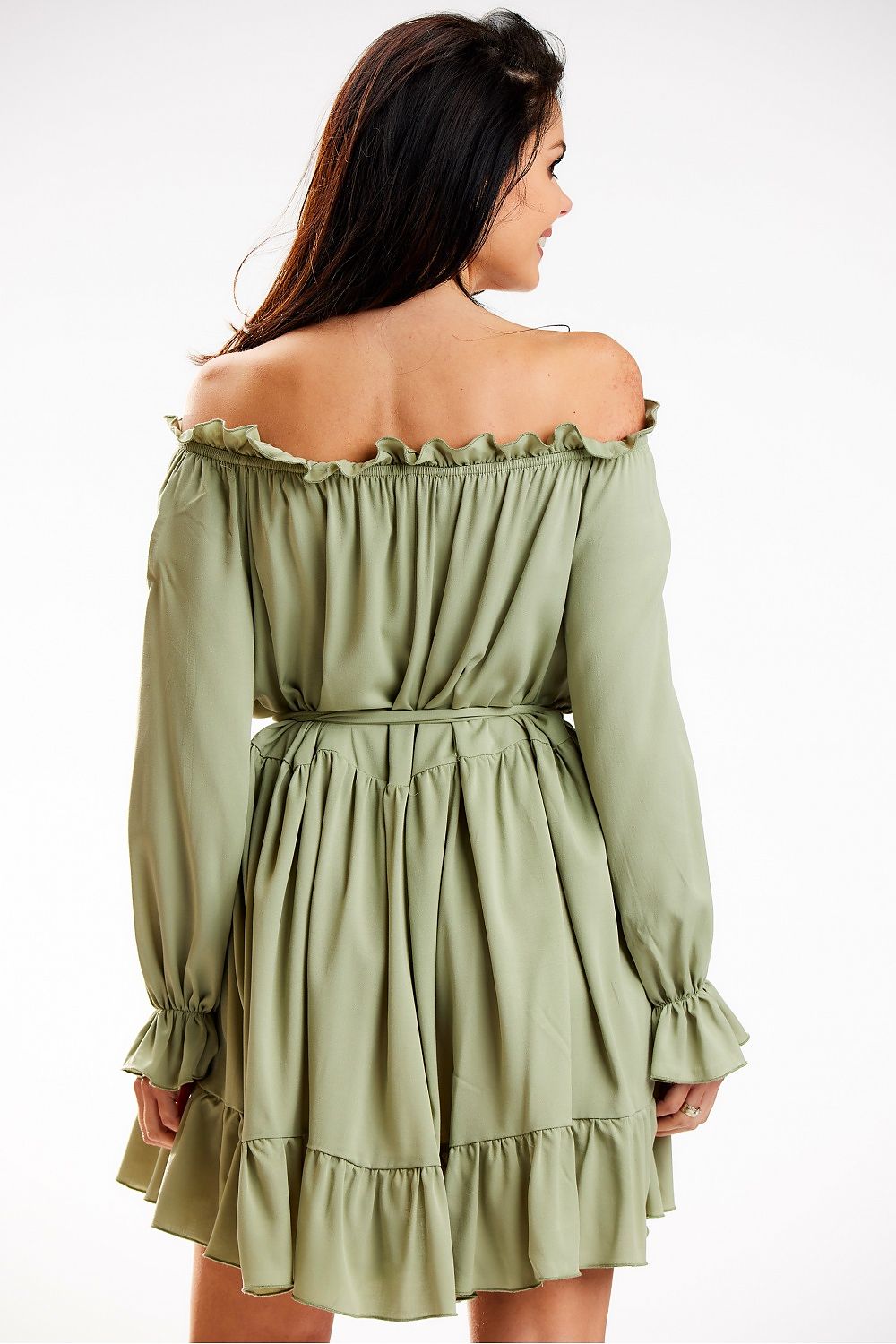 The back view of a sophisticated Awama Spanish A-Line dress in soft green, highlighting its flowing silhouette and stylish waist tie, perfect for modern elegance.