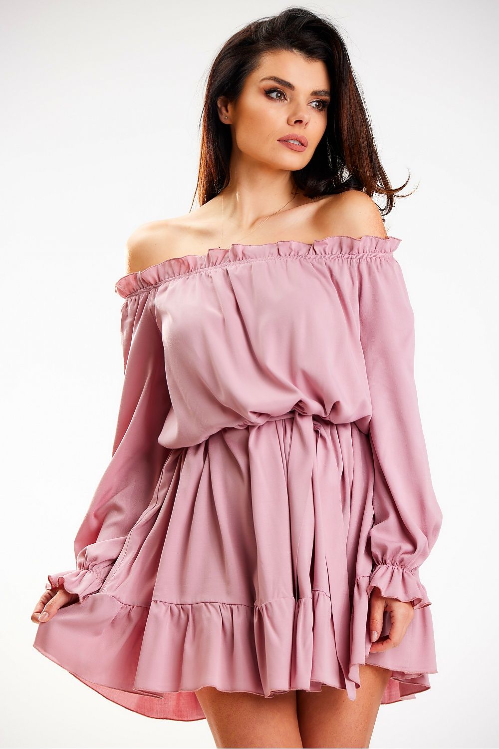 Chic Awama Spanish A-Line dress in soft mauve, elegantly worn off-shoulder with long sleeves, accentuated by a frill and styled for a sophisticated daytime look.
